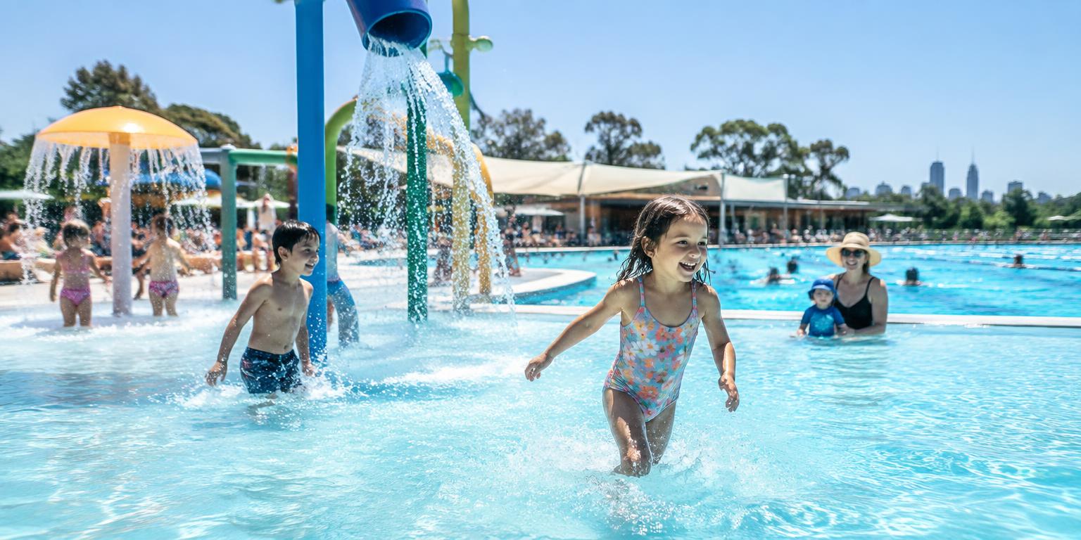 Children enjoying an outdoor splash pool